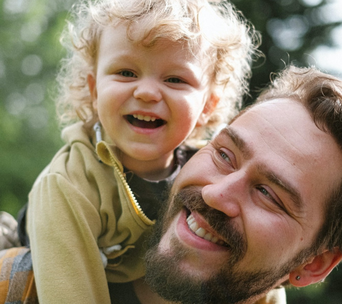 Dad and baby smiling 